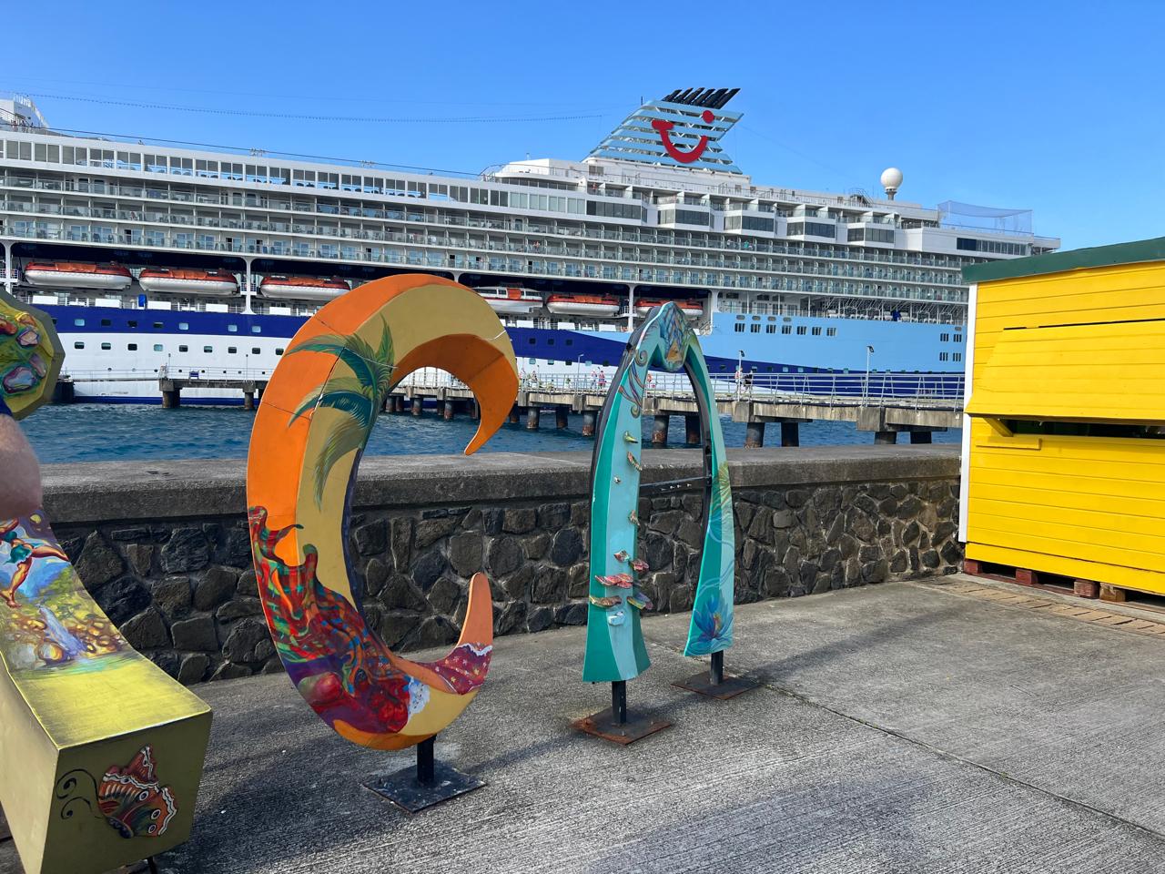 Colourful sculptural letters and a yellow pavilion on the waterfront