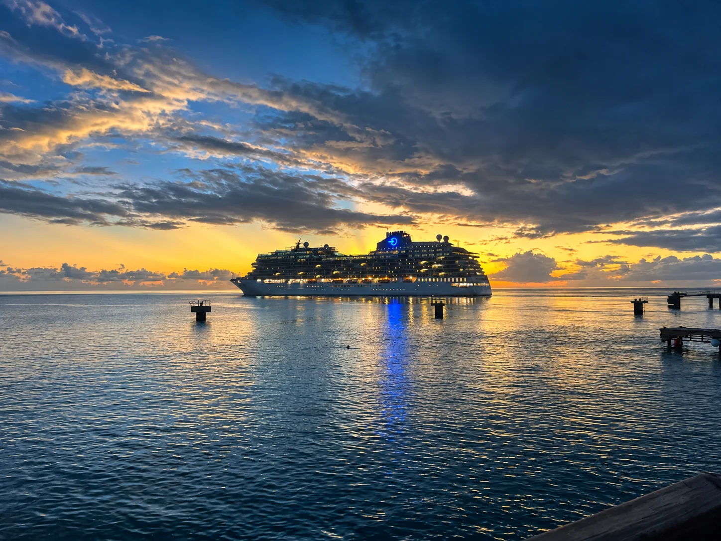 A ship at sea beneath the evening sky